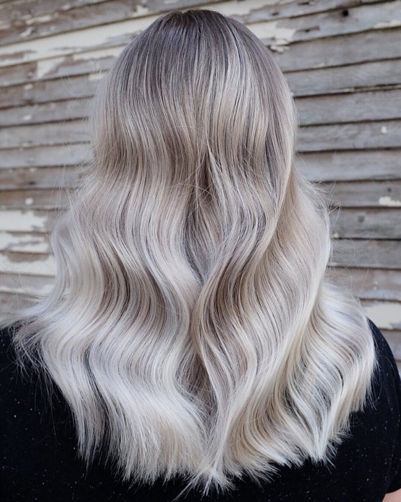 A shot of a woman’s light, platinum blonde hair from behind